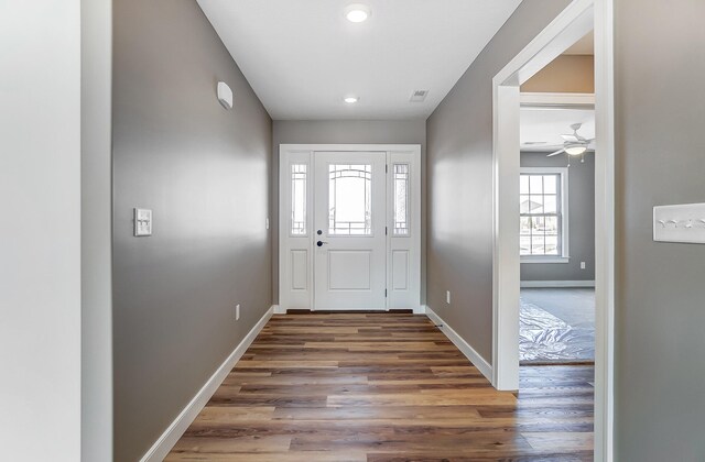 1129 Auburn St, Troy, OH 45373 - entrance foyer featuring baseboards, visible vents, wood finished floors, and ceiling fan