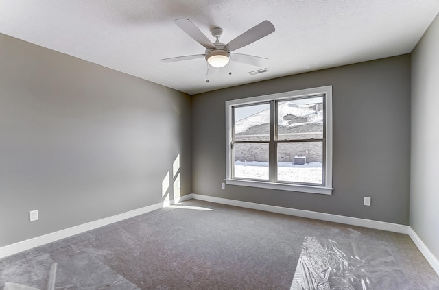 1129 Auburn St, Troy, OH 45373 - carpeted spare room with a textured ceiling, baseboards, ceiling fan, and visible vents