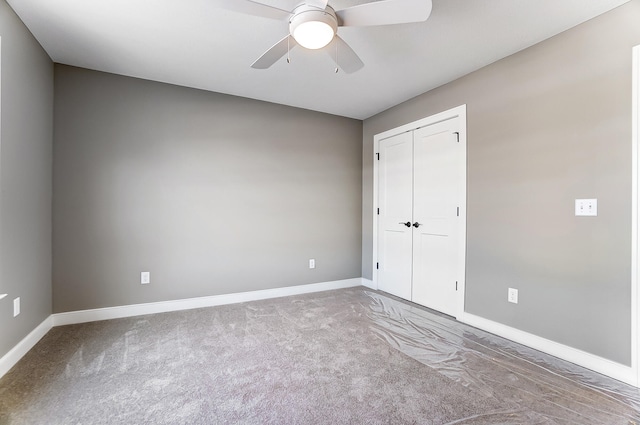 1129 Auburn St, Troy, OH 45373 - unfurnished bedroom featuring baseboards, a closet, carpet floors, and a ceiling fan