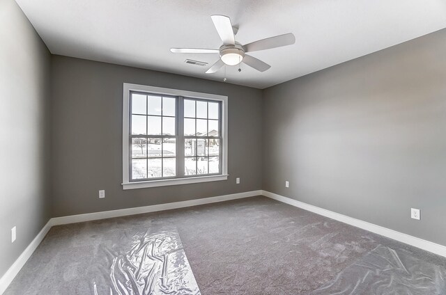 1129 Auburn St, Troy, OH 45373 - spare room with baseboards, carpet flooring, ceiling fan, and visible vents