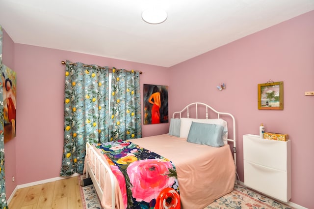 bedroom with light hardwood / wood-style floors