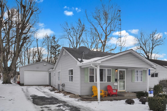 view of front facade featuring a garage and an outdoor structure