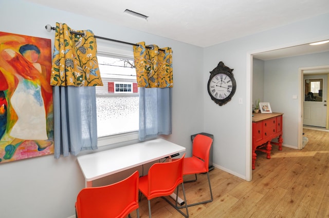 dining room with light hardwood / wood-style flooring