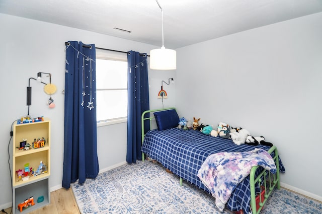 bedroom featuring wood-type flooring