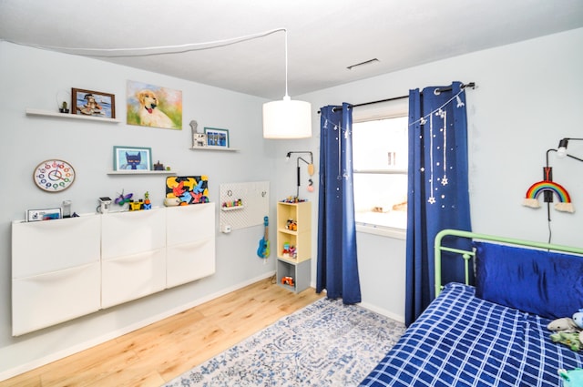 bedroom with wood-type flooring