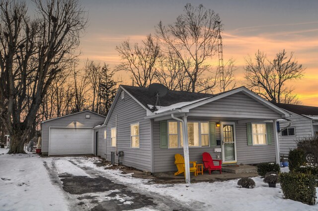 view of front facade with an outbuilding and a garage