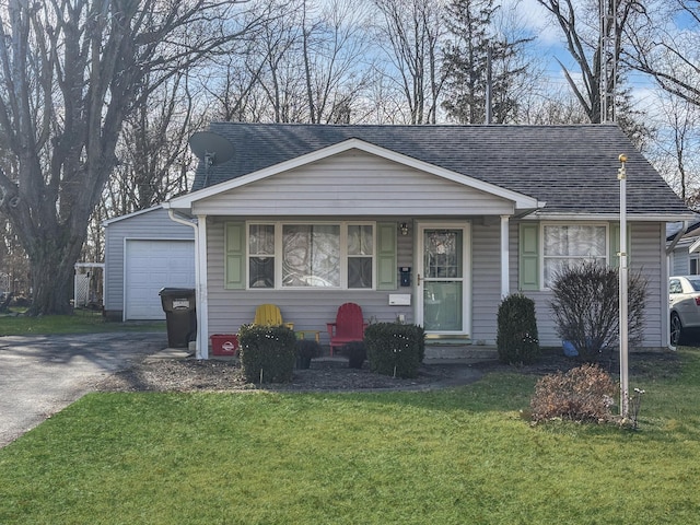 view of front of home with a garage and a front yard