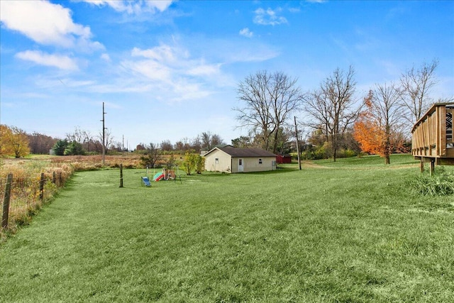 view of yard featuring fence and a wooden deck