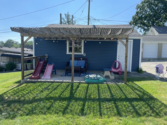 1211 N Lowry Ave, Springfield, OH 45504 - back of house featuring a pergola, a lawn, a patio area, and a shingled roof