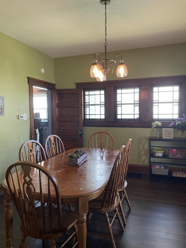 1211 N Lowry Ave, Springfield, OH 45504 - dining area with a chandelier and dark wood-type flooring
