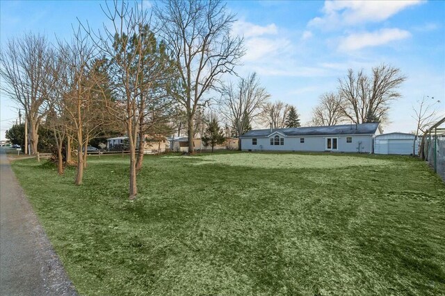 view of yard with a garage