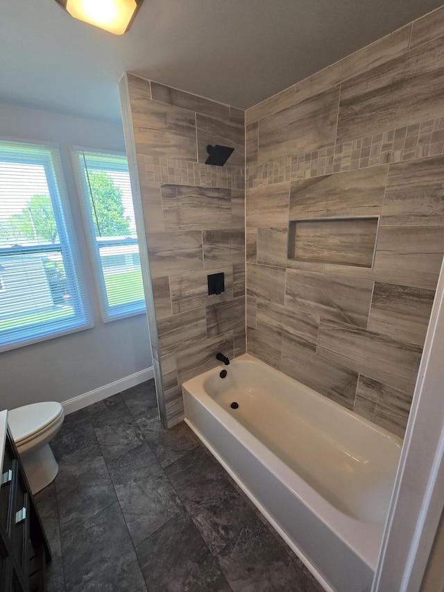 318 W Buckeye St, Belle Center, OH 43310 - bathroom featuring tub / shower combination, baseboards, and toilet