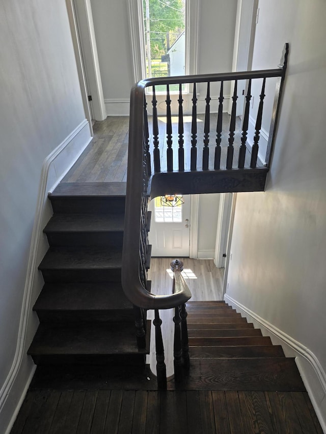 318 W Buckeye St, Belle Center, OH 43310 - staircase featuring hardwood / wood-style floors and baseboards