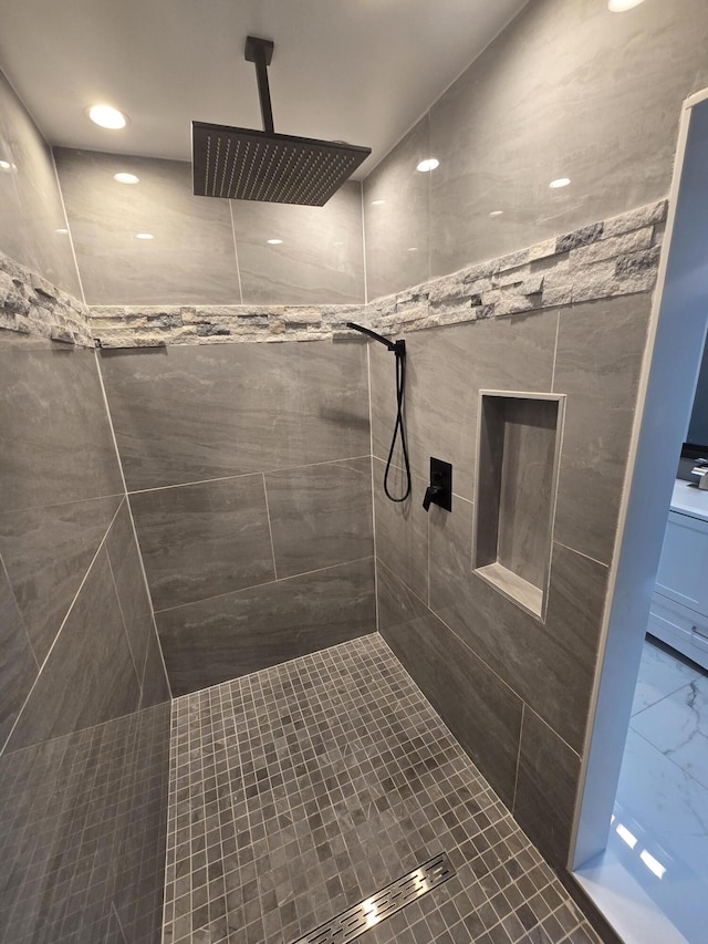318 W Buckeye St, Belle Center, OH 43310 - bathroom with marble look tile flooring, tiled shower, and recessed lighting