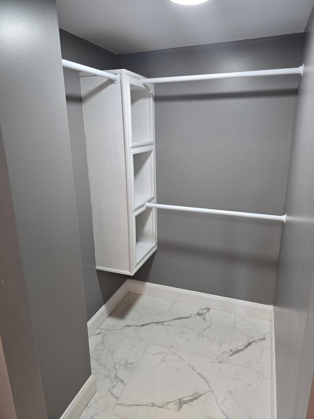 318 W Buckeye St, Belle Center, OH 43310 - walk in closet featuring marble look tile flooring