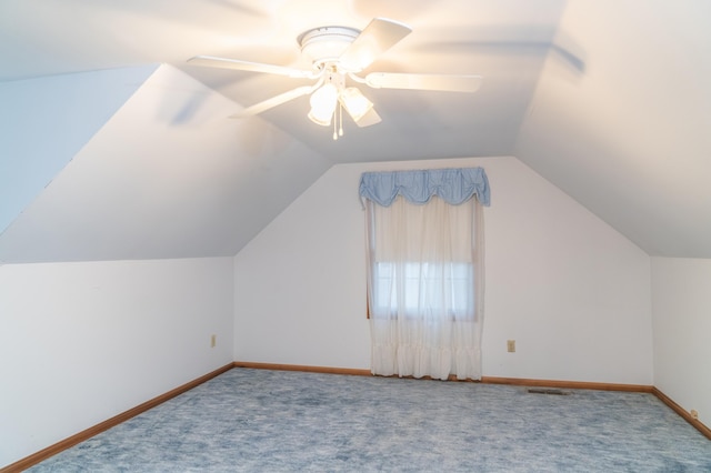 bonus room with ceiling fan, carpet, and baseboards