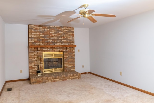 unfurnished living room featuring carpet, a fireplace, visible vents, and baseboards