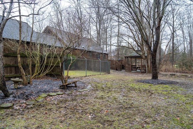 view of yard with a gazebo and fence