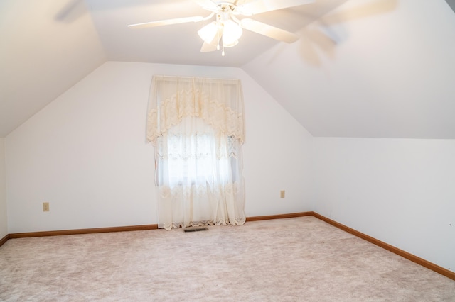 bonus room featuring carpet, ceiling fan, lofted ceiling, and baseboards