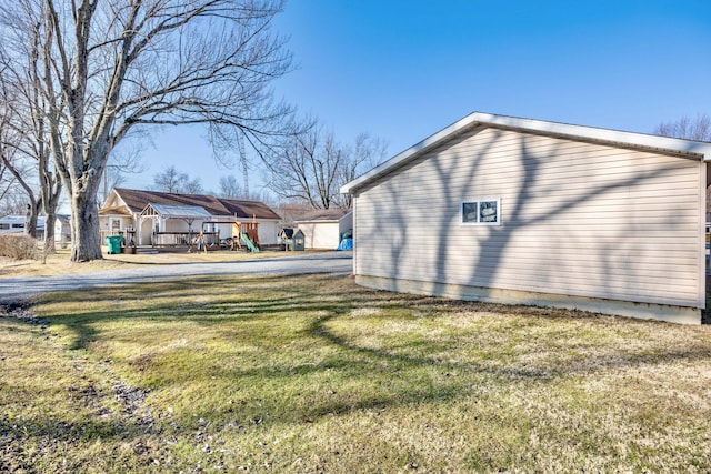 view of home's exterior with a yard