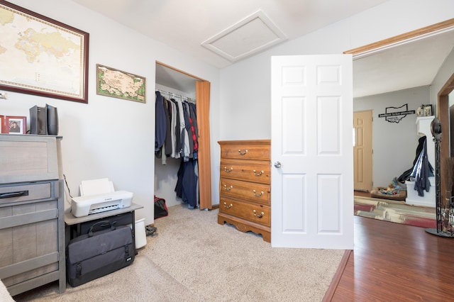 interior space with attic access and wood finished floors