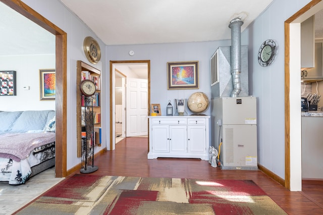 interior space with baseboards and dark wood finished floors