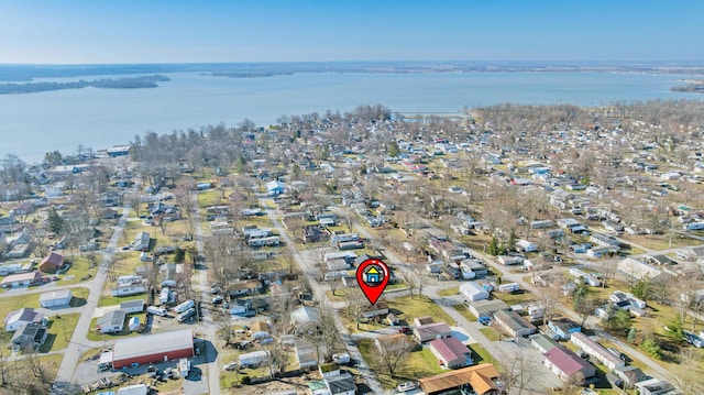 birds eye view of property with a residential view and a water view