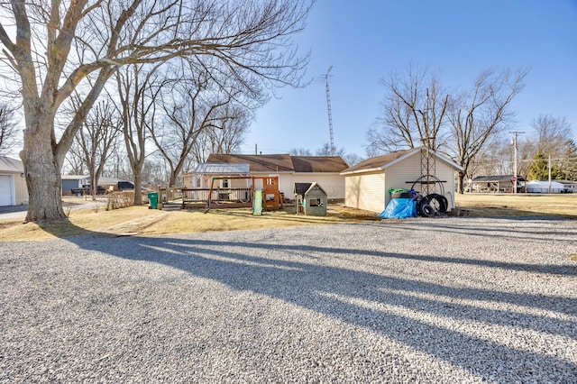 view of front of home with a storage shed, an outbuilding, and a detached garage