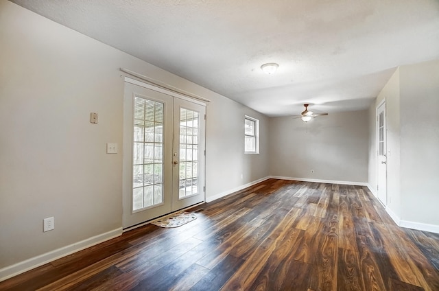 unfurnished room with dark hardwood / wood-style floors, a textured ceiling, french doors, and ceiling fan