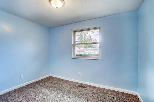 spare room featuring carpet flooring