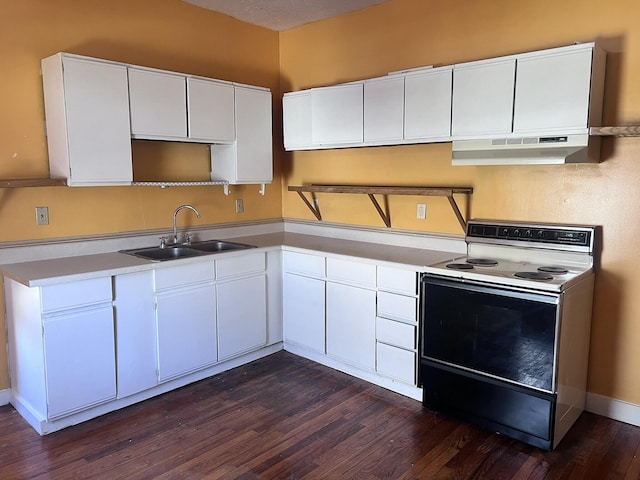 kitchen with dark wood finished floors, white electric stove, white cabinetry, a sink, and under cabinet range hood