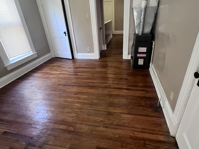 interior space featuring dark wood-style floors and baseboards