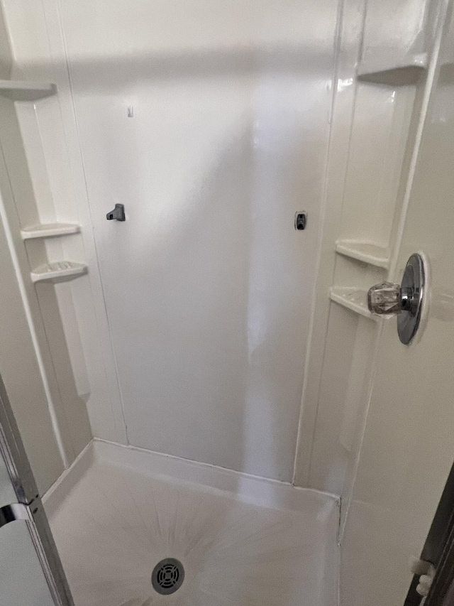 bathroom featuring a stall shower