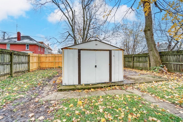 view of shed featuring a fenced backyard