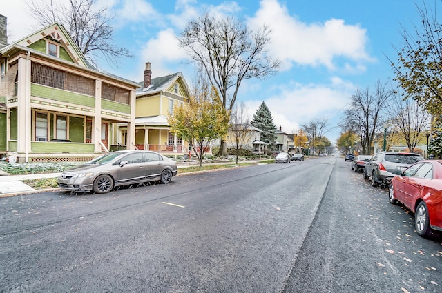 view of road with a residential view and sidewalks