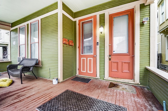 doorway to property featuring covered porch