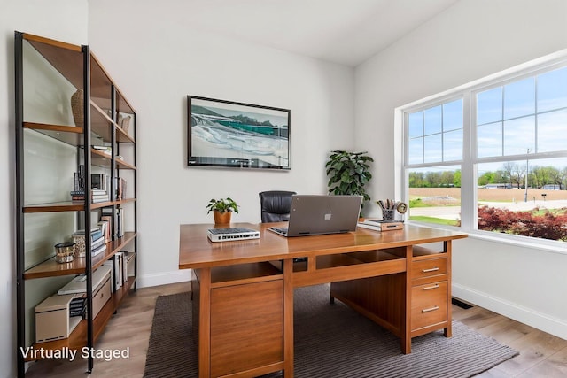 home office featuring light wood-style floors and baseboards