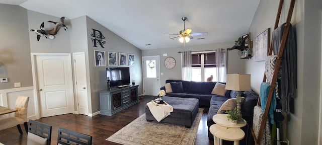 living room with ceiling fan, vaulted ceiling, and dark hardwood / wood-style flooring