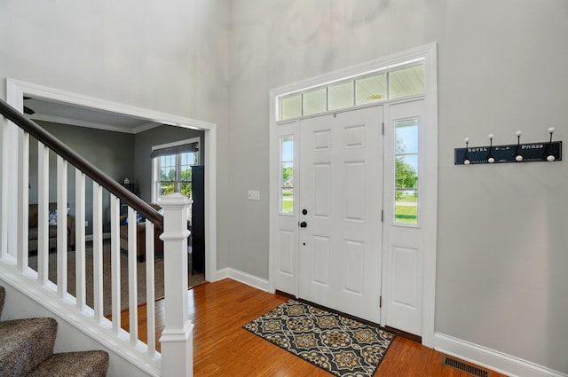 4114 Brookston Dr, Springfield, OH 45502 - foyer featuring stairway, wood finished floors, baseboards, and a towering ceiling
