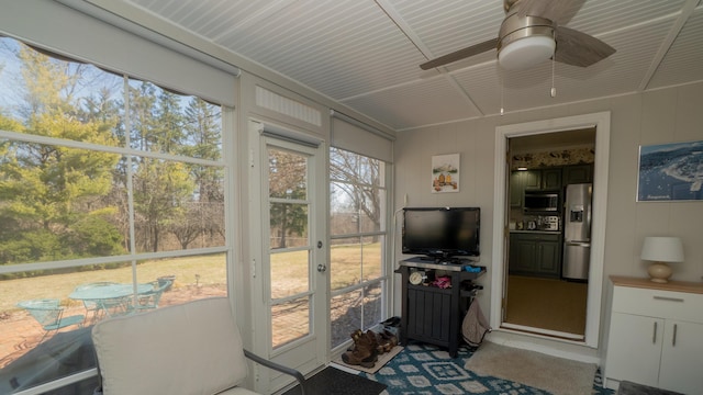 sunroom featuring plenty of natural light and ceiling fan