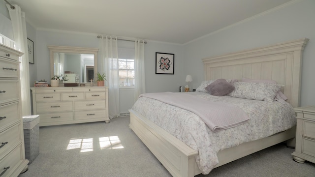 bedroom with light colored carpet and crown molding