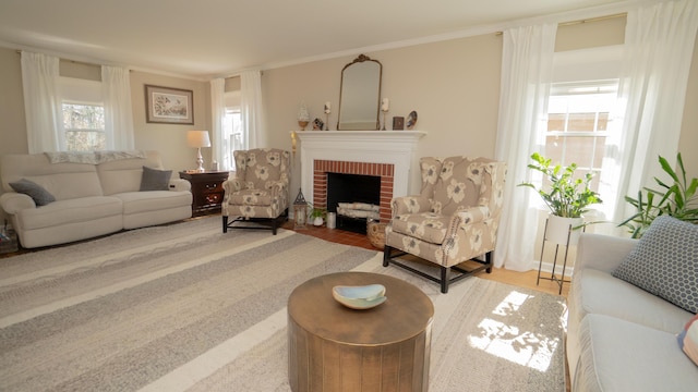 living area with a fireplace and crown molding