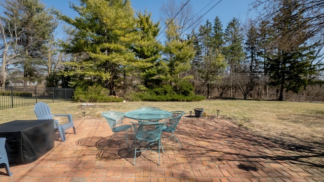 view of patio with outdoor dining area and fence