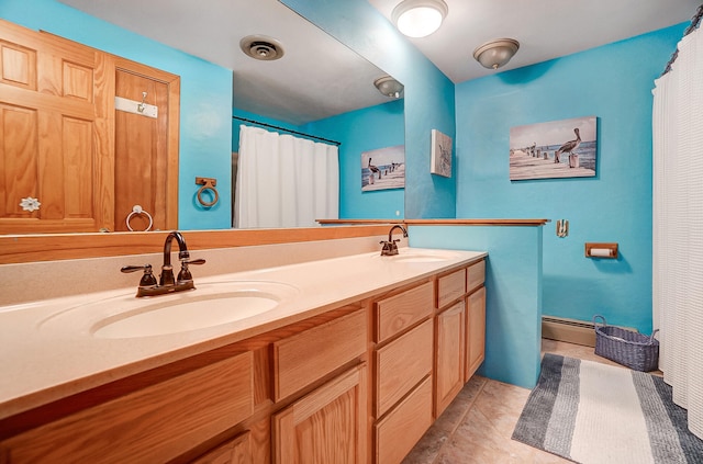 full bath with double vanity, a sink, visible vents, and tile patterned floors