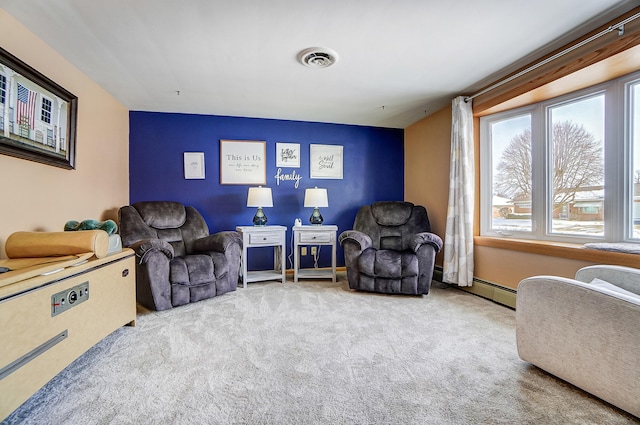 living area featuring light colored carpet, visible vents, and baseboards