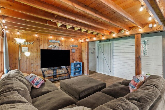 11350 Powhatan Path, Lakeview, OH 43331 - living room with wood finished floors, wood walls, and a wood ceiling with exposed beams