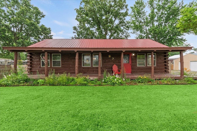 11350 Powhatan Path, Lakeview, OH 43331 - log cabin with log exterior, a front lawn, a porch, and a metal roof