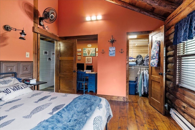11350 Powhatan Path, Lakeview, OH 43331 - bedroom with a baseboard heating unit, wooden ceiling, wood-type flooring, log walls, and a desk