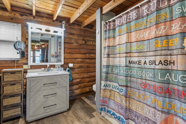 11350 Powhatan Path, Lakeview, OH 43331 - full bathroom with rustic walls, vanity, a wood ceiling with exposed beams, wood finished floors, and a shower with curtain
