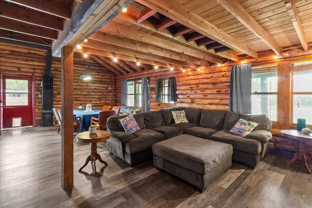 11350 Powhatan Path, Lakeview, OH 43331 - living area featuring log walls, healthy amount of natural light, wood finished floors, and a wood ceiling with exposed beams